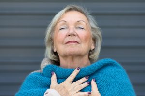 Older Woman feeling peaceful grateful balanced